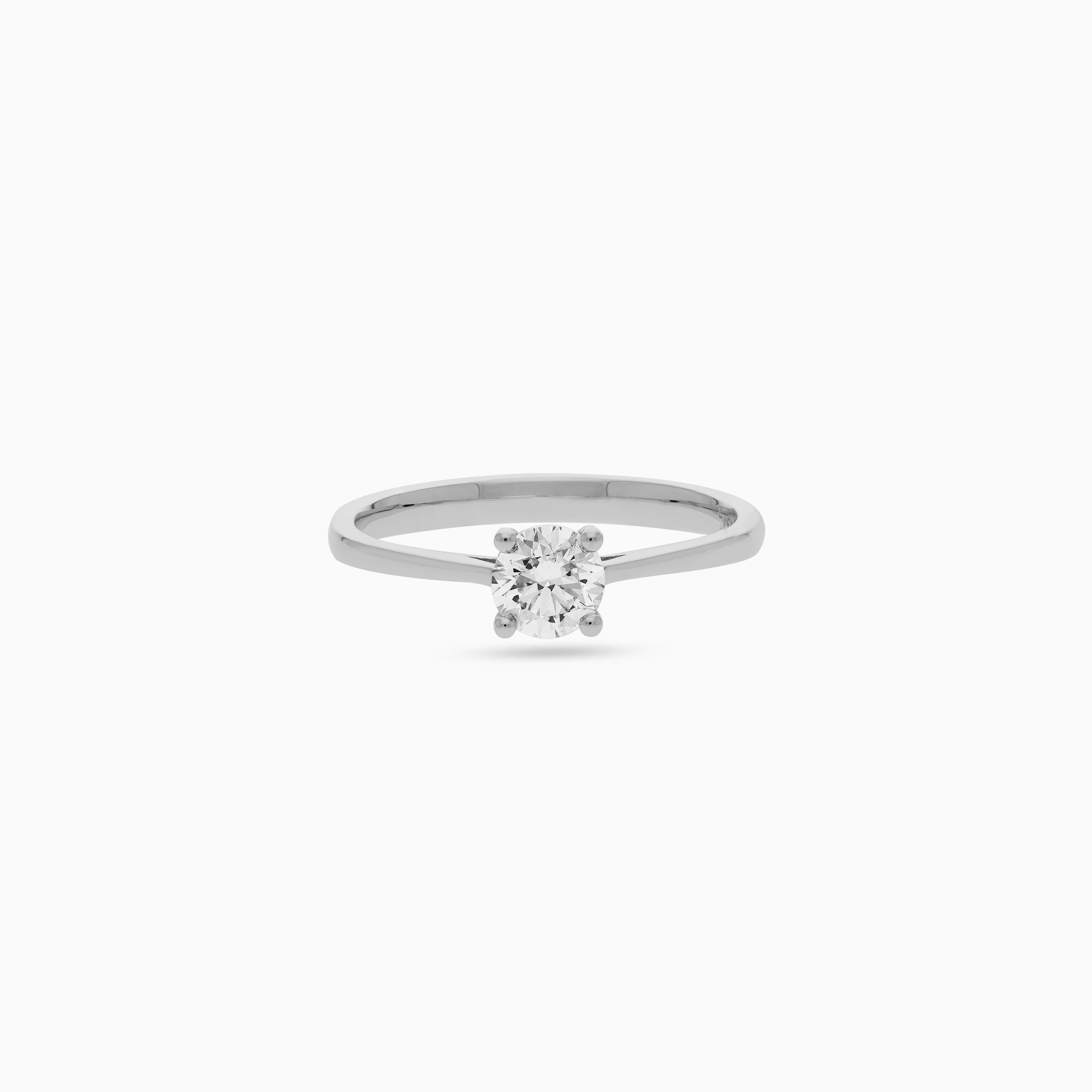 18k white gold ring decorated with single DIAMOND SOLITAIRE stones